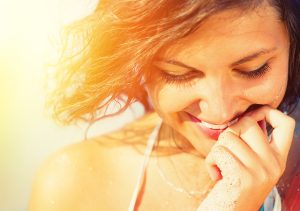 Beauty Sunshine Girl Portrait. Happy Woman Smiling and looking D