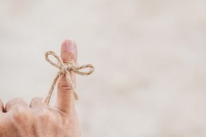 String tired around finger, selective focus, soft focus vintage tone