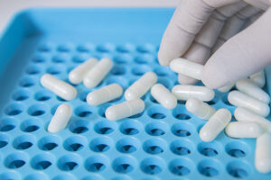 White Capsules in Pharmacy Lab